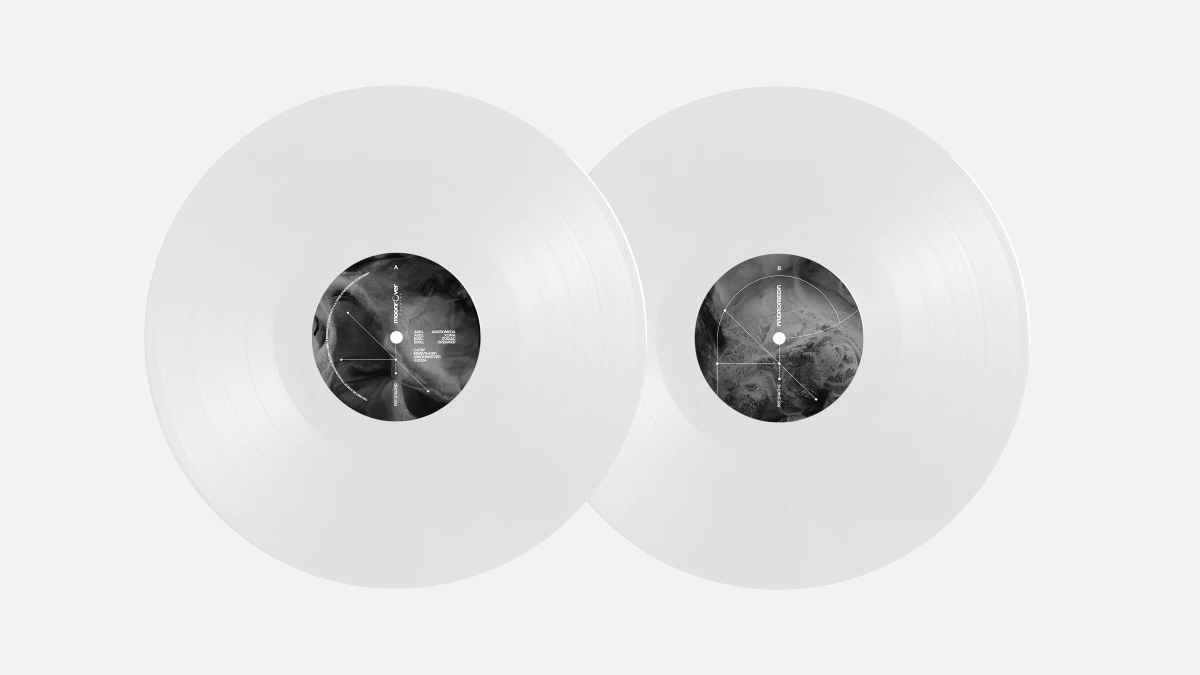 Two white vinyl records with Andromeda labels placed side by side