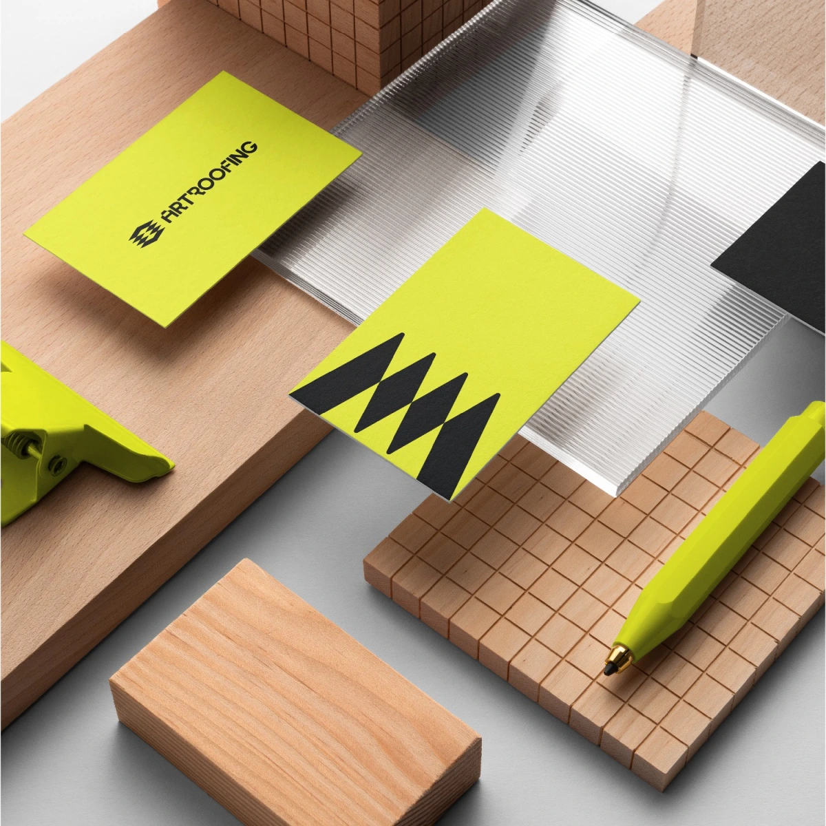 Art Roofing business cards and pen on wood blocks