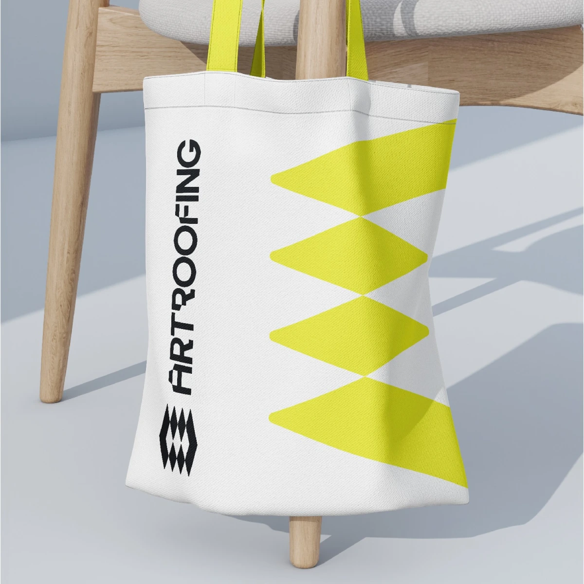 Art Roofing tote bag with zigzag pattern on chair