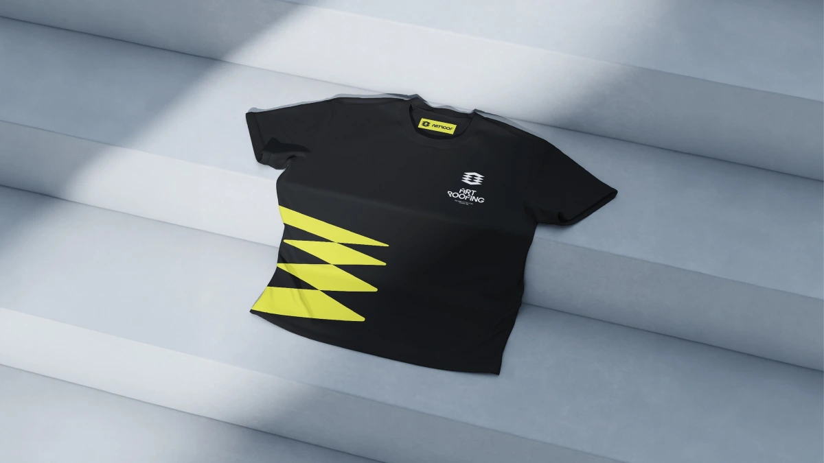 Art Roofing black t-shirt with yellow diamond stripe logo on steps