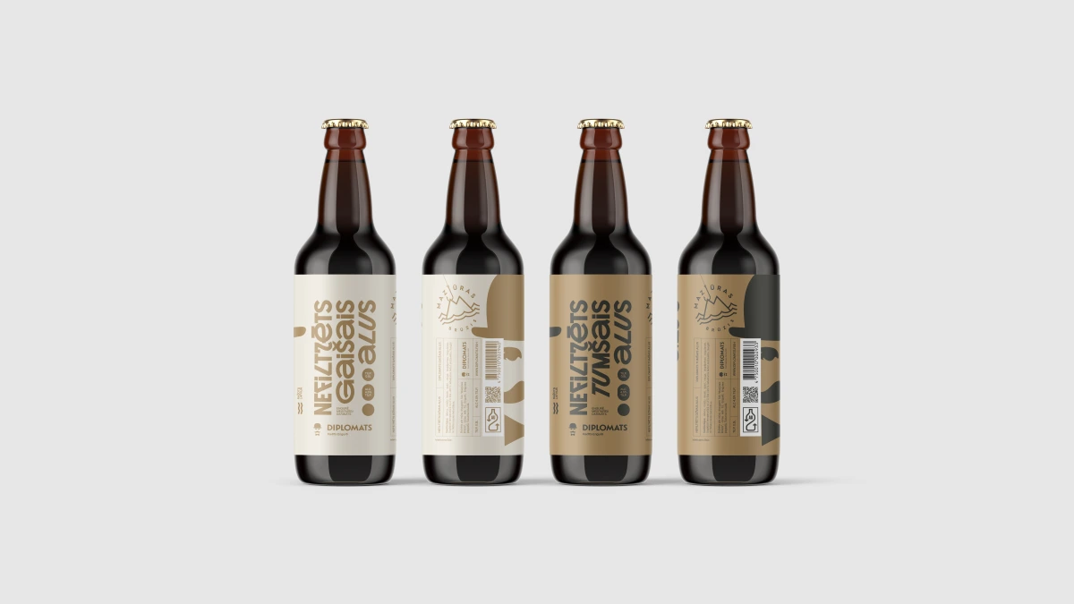 Four Diplomats beer bottles in a row, light and dark labels