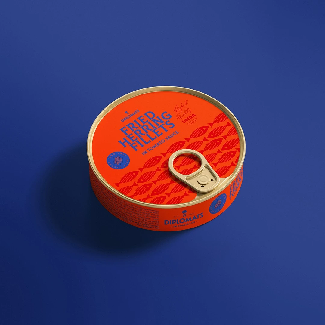 Diplomats Fried Herring Fillets tin in tomato sauce on blue background