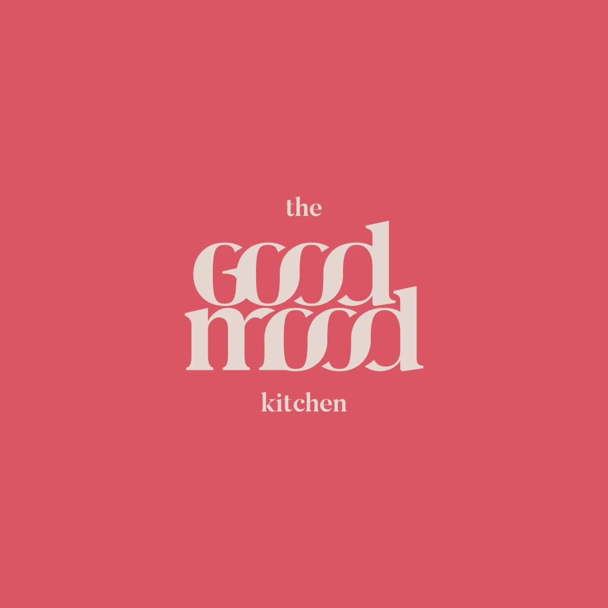The Good Mood Kitchen logo lockup on coral pink background