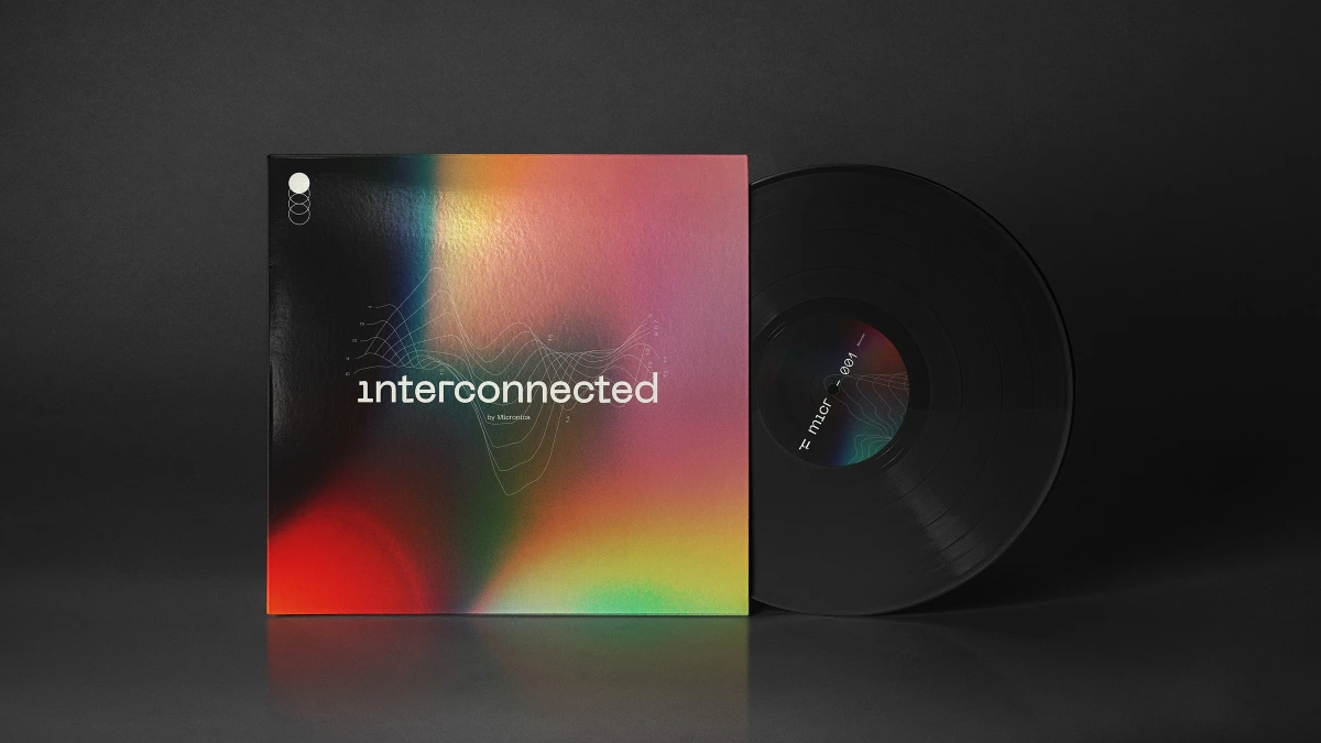 Interconnected vinyl record sleeve with rainbow gradient cover and black record