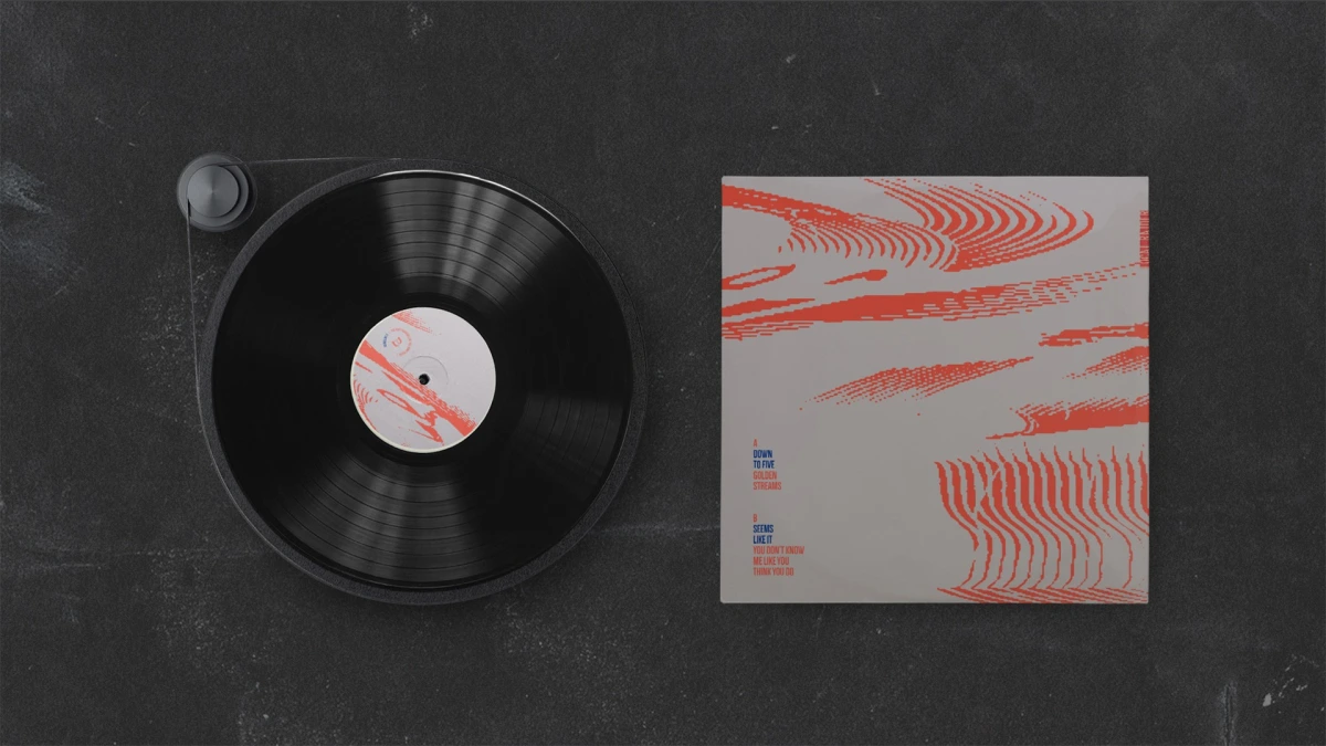 Black vinyl record on a turntable next to The Closing Set EP sleeve