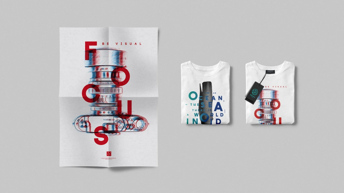 Medoosa Focus poster and two folded t-shirts with camera lens illustration