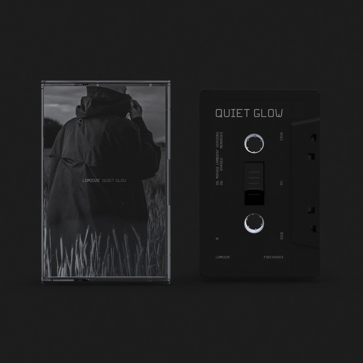 Quiet Glow cassette J-card with hooded figure photo beside black cassette shell