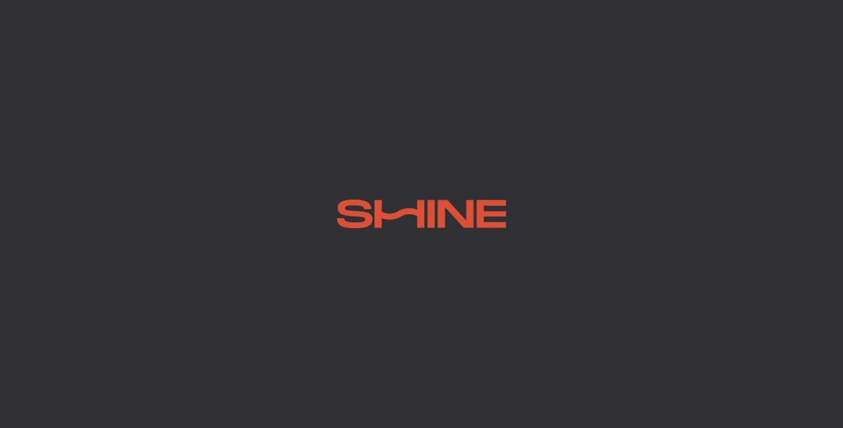 Orange Shine logo on a dark charcoal background
