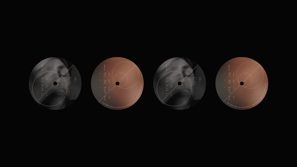 Four The Gimp vinyl labels alternating grey and copper tones